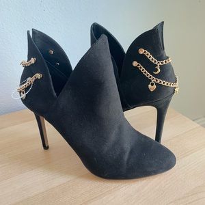 Black heeled ankle boots with gold detail